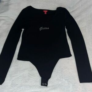 Women’s size medium black bodysuit worn once has Rhinestones that say guess